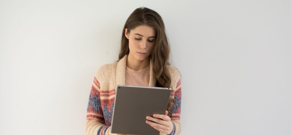 Woman browses social media on her tablet